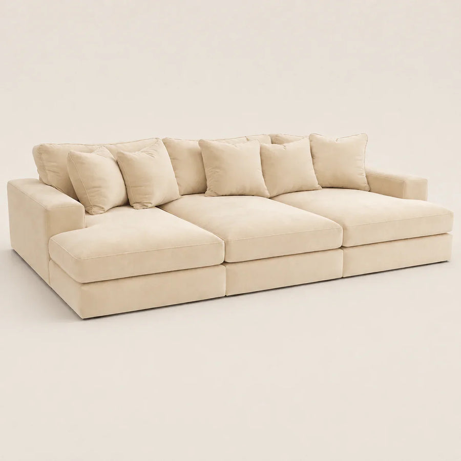 Cream modular sectional sofa with plush cushions, ideal for luxury living room furniture