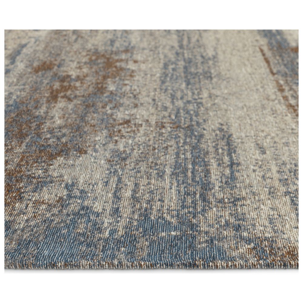 Blue and beige vintage-style area rug with distressed pattern and textured weave