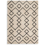 Cream shaggy rug with black geometric diamond pattern, luxury home decor