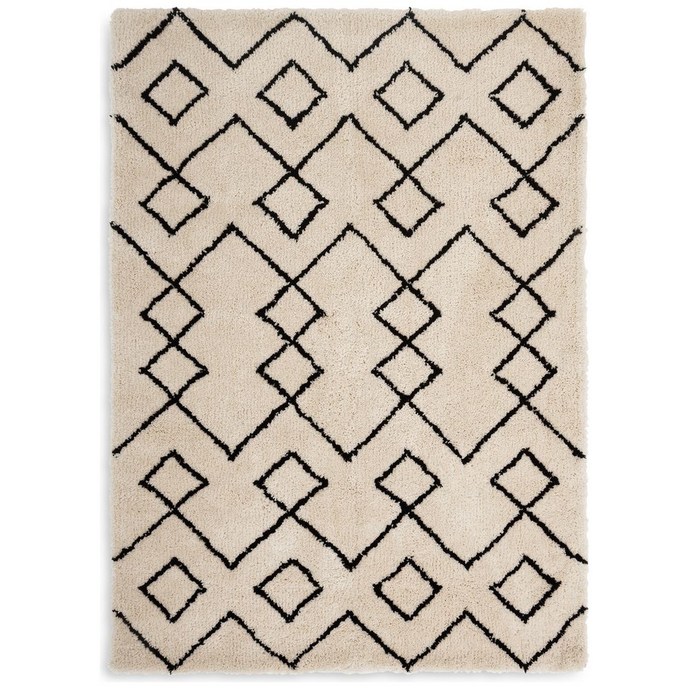 Cream shaggy rug with black geometric diamond pattern, luxury home decor