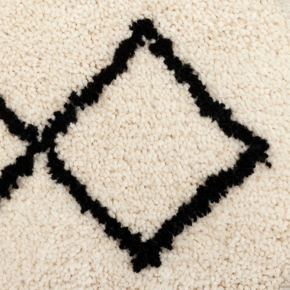 Cream wool rug with black diamond pattern, cozy textured floor covering for living room
