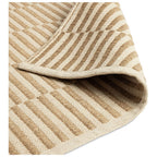 Beige and cream striped woven rug with textured pattern, ideal for living room or bedroom decor