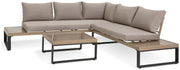 Modern outdoor sectional sofa with beige cushions and matching coffee tables, perfect for luxury patio furniture.