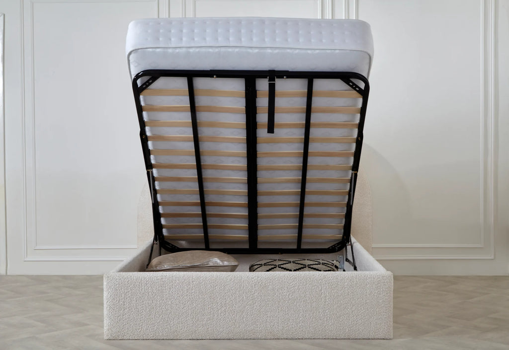 Upholstered ottoman storage bed with lifted mattress revealing spacious underbed storage