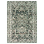 Vintage-style area rug with distressed floral pattern in sage green and charcoal, perfect for living room decor.