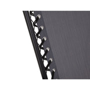 Close-up of grey fabric sofa with black lacing and metal eyelets, showcasing durable upholstery detail.