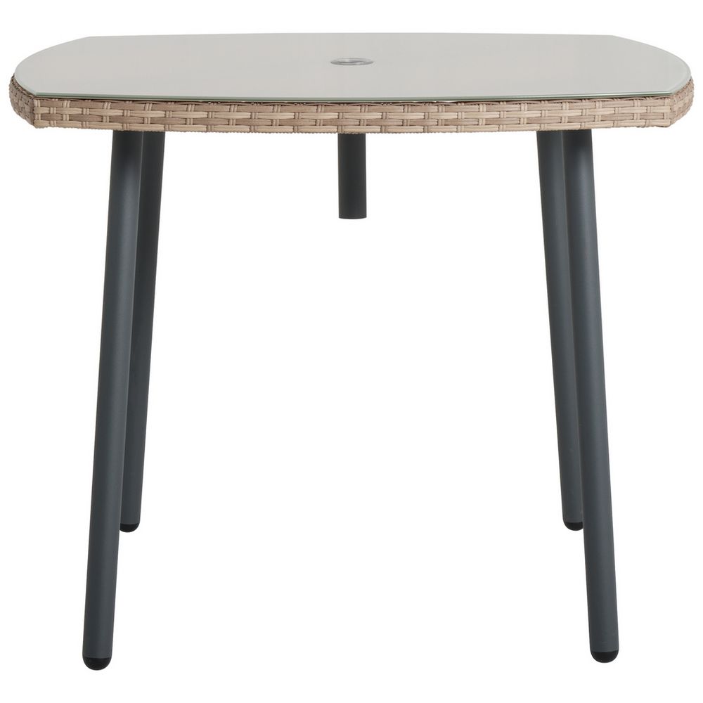 Wicker outdoor table with glass top and black metal legs, perfect for patio or garden use