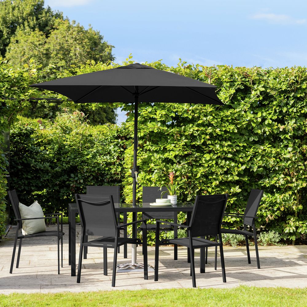 Black outdoor dining set with umbrella on patio, perfect for garden entertaining