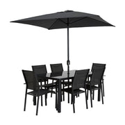Black outdoor dining set with glass table, 6 chairs, and large patio umbrella for garden or terrace use