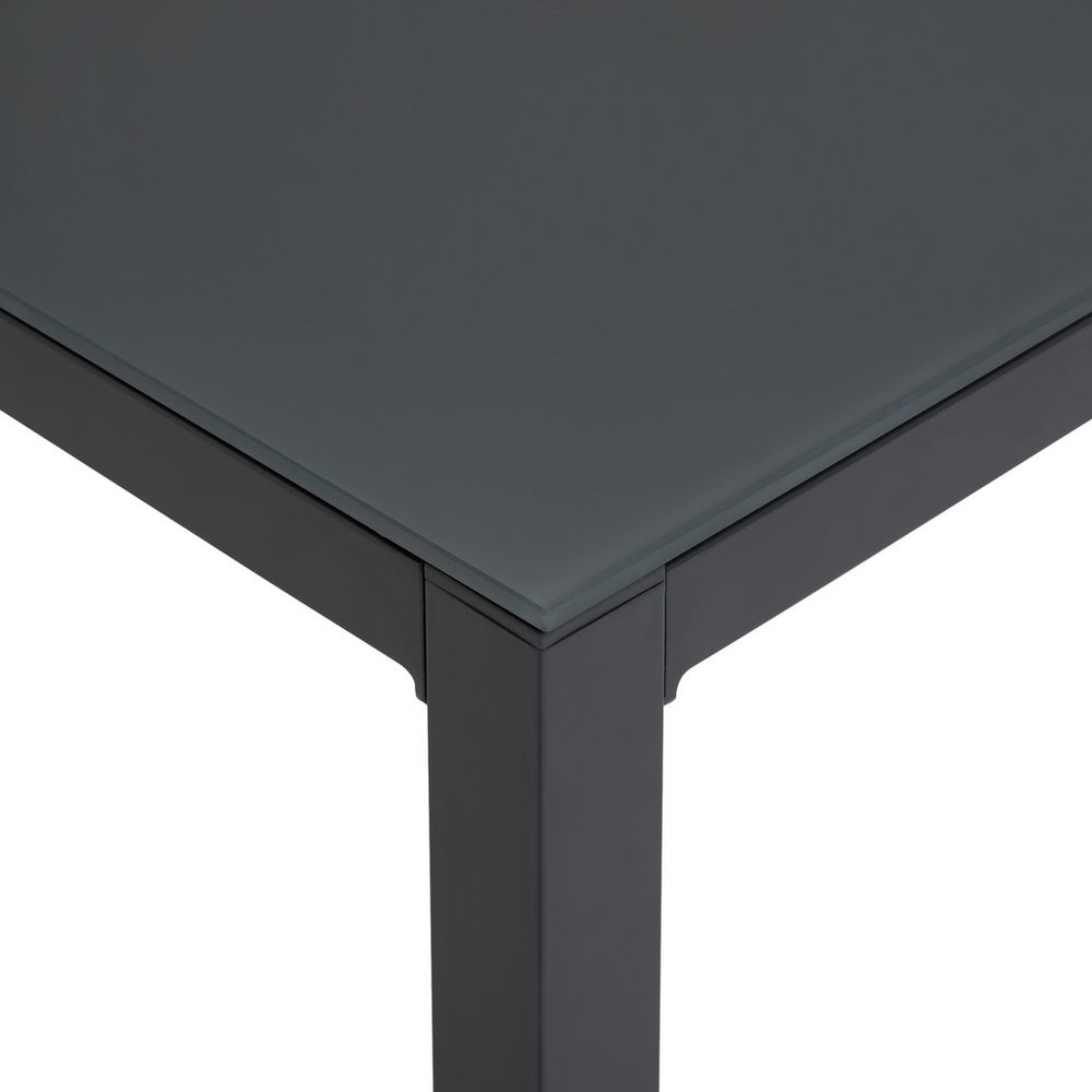 Modern black glass-top table with sleek metal legs, contemporary dining furniture