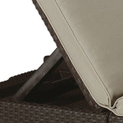 Dark woven wicker outdoor lounge chair with beige cushion, perfect for patio relaxation.