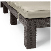 Woven wicker outdoor sofa with beige cushion, luxury patio furniture