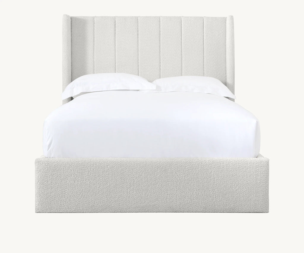 Modern upholstered bed with vertical panel headboard and white bedding