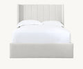 Modern upholstered bed with vertical panel headboard and white bedding