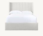 Modern upholstered bed with vertical panel headboard and white bedding
