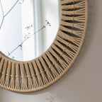 Round woven rope mirror with macrame detailing, perfect for boho home decor