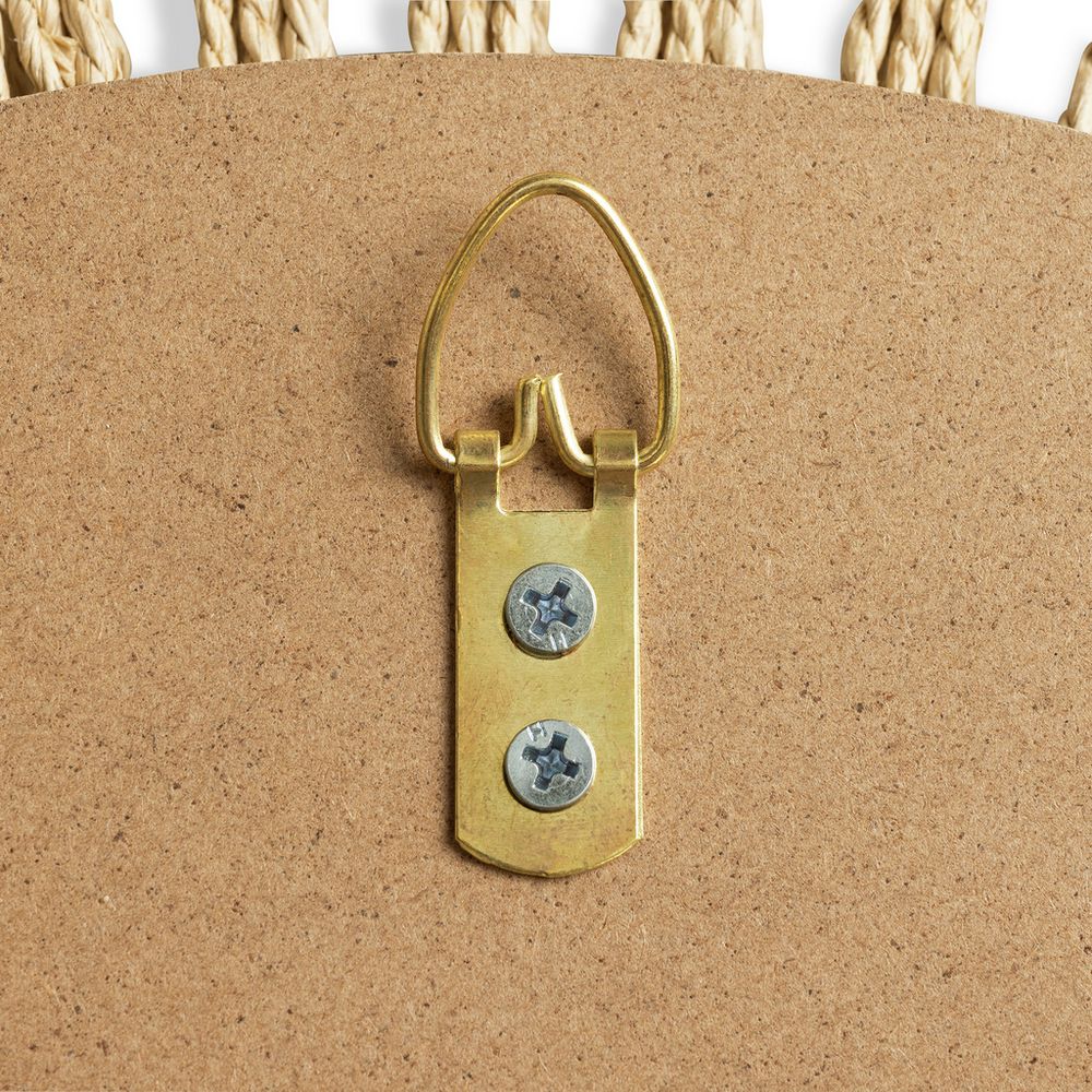 Brass hanging loop with screws on corkboard, natural rope border detail