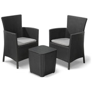 Black wicker outdoor patio set with two armchairs and side table, grey cushions included