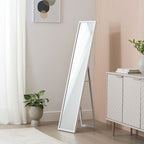Full-length white standing mirror in modern living room with plants and sideboard