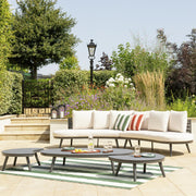Luxury outdoor sofa set with striped cushions on patio, perfect for garden relaxation and al fresco living.