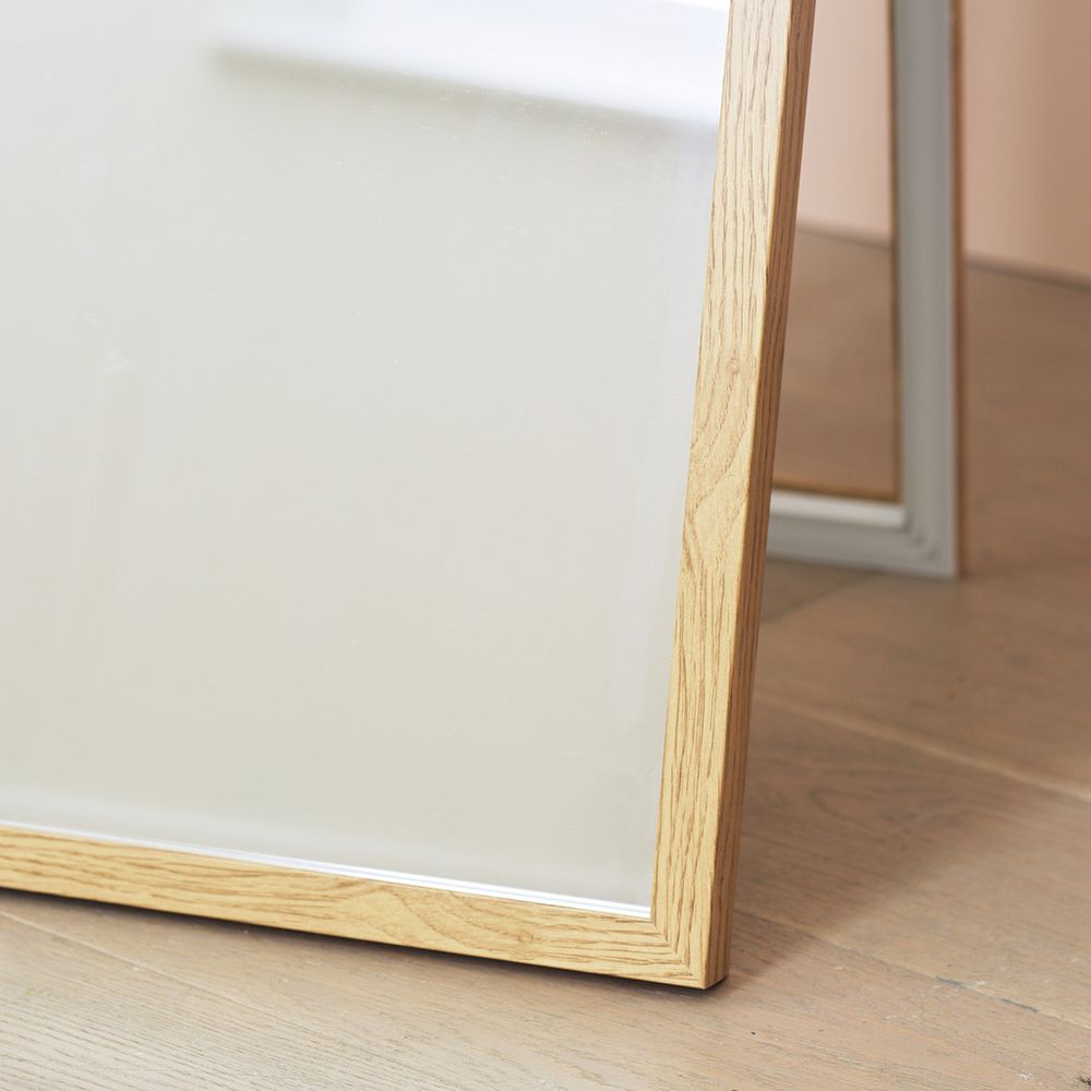 Full-length floor mirror with light oak wood frame, modern bedroom decor