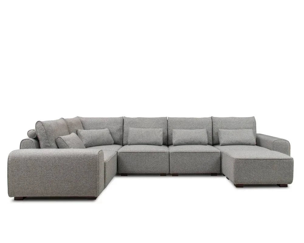 Modern grey corner sectional sofa with chaise and plush cushions, spacious seating design