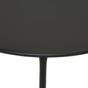 Black round side table with sleek metal leg, modern minimalist design for living room