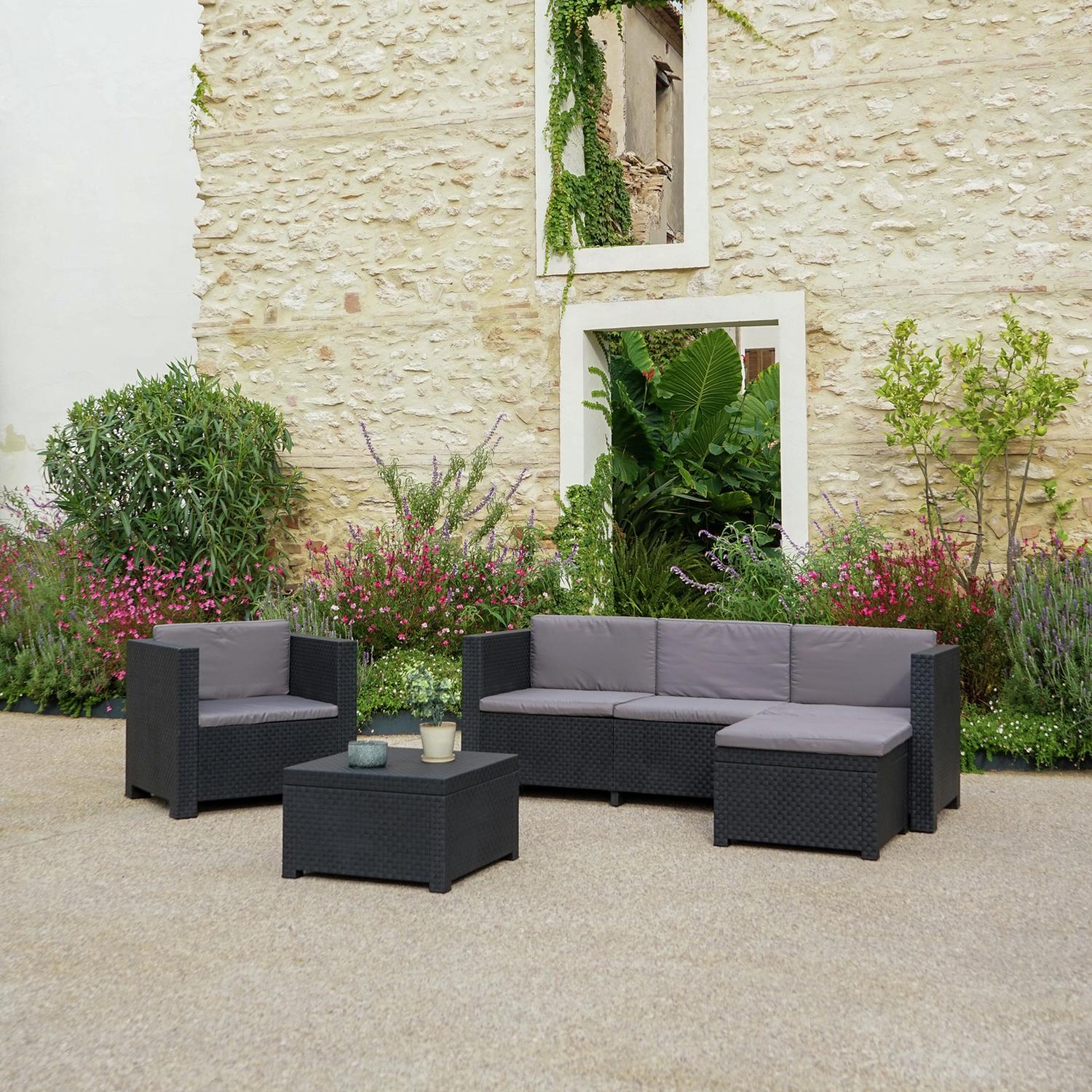 Modern outdoor wicker sofa set with grey cushions, perfect for garden or patio relaxation