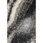 Luxury plush rug with abstract black, gray, and cream pattern for modern living spaces