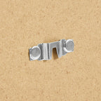 Metal sofa bed connector hardware on cardboard background