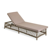 Wicker outdoor chaise lounge with beige cushion, perfect for patio relaxation
