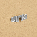 Silver metal sofa bed hinge hardware on cardboard background