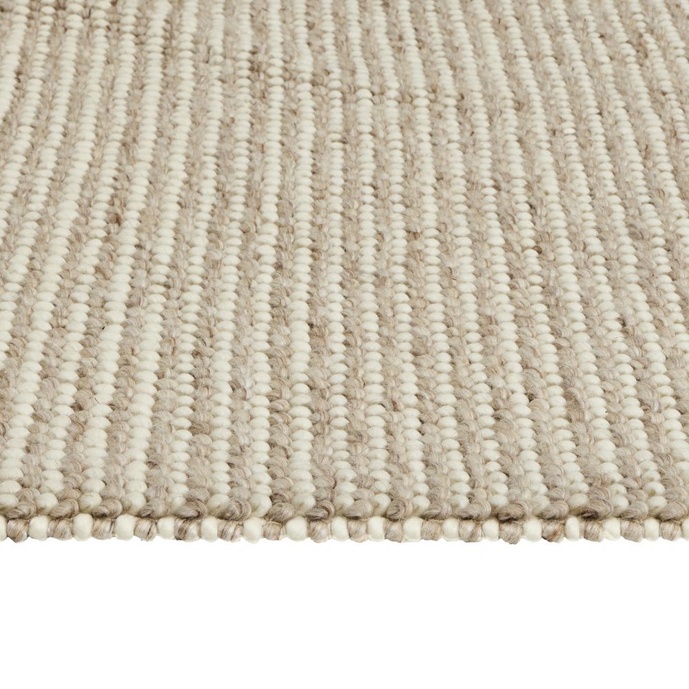 Cream and beige striped woven rug with textured loop pile, ideal for living room or bedroom decor.