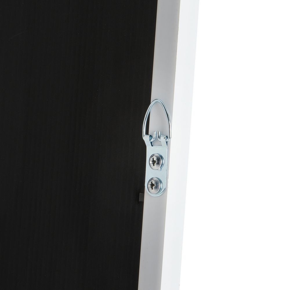 Metal D-ring hardware on black furniture panel, white frame detail
