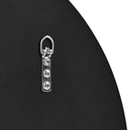 Metal D-ring hardware with three screws on black furniture panel