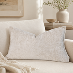 Beige textured lumbar pillow on luxury sofa, cozy living room decor with neutral tones