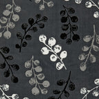 Dark grey fabric with black, white, and grey berry branch pattern for luxury sofas and beds