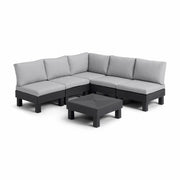 Modular outdoor sectional sofa with gray cushions and black frame, includes matching coffee table