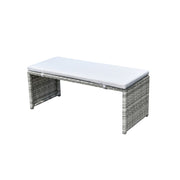 Grey wicker outdoor bench with white cushion, perfect for patio or garden seating