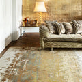 Luxury patterned sofa with striped cushions on distressed area rug in modern living room