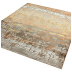Abstract area rug with distressed beige, gold, and gray tones for modern living spaces