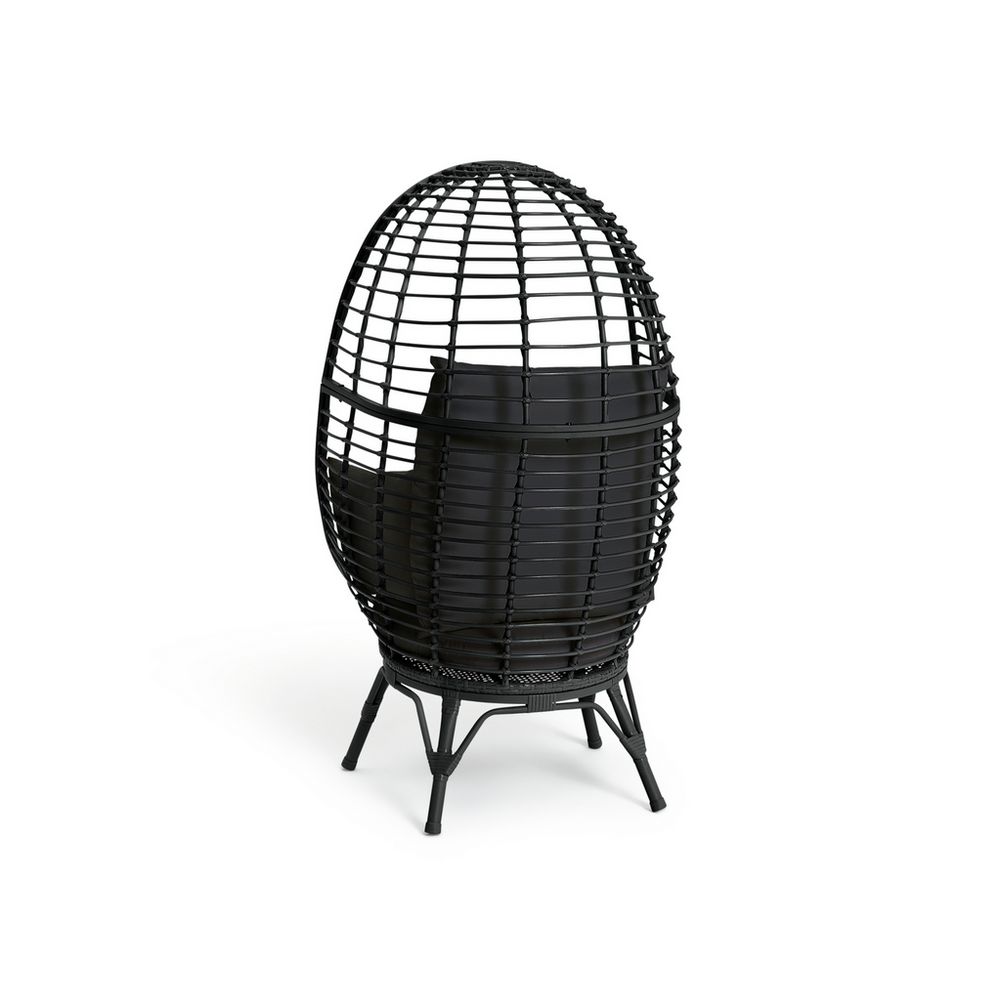Black egg-shaped wicker chair with cushion, modern lounge seating for luxury living spaces