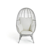Gray wicker egg chair with cream cushions, modern lounge seating for living room or patio
