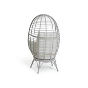 Grey egg-shaped wicker chair with white cushion, modern luxury living room furniture