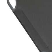 Dark grey fabric sofa detail with stitched seam and metal frame corner