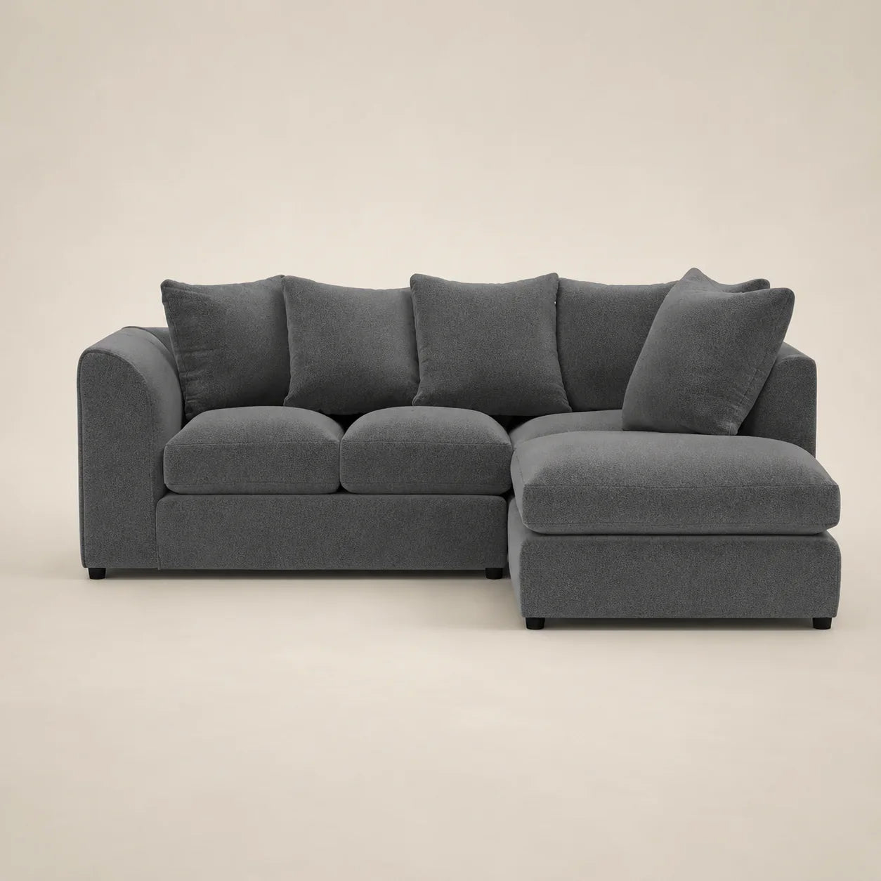 Grey fabric sectional sofa with chaise lounge and plush cushions, modern luxury living room furniture