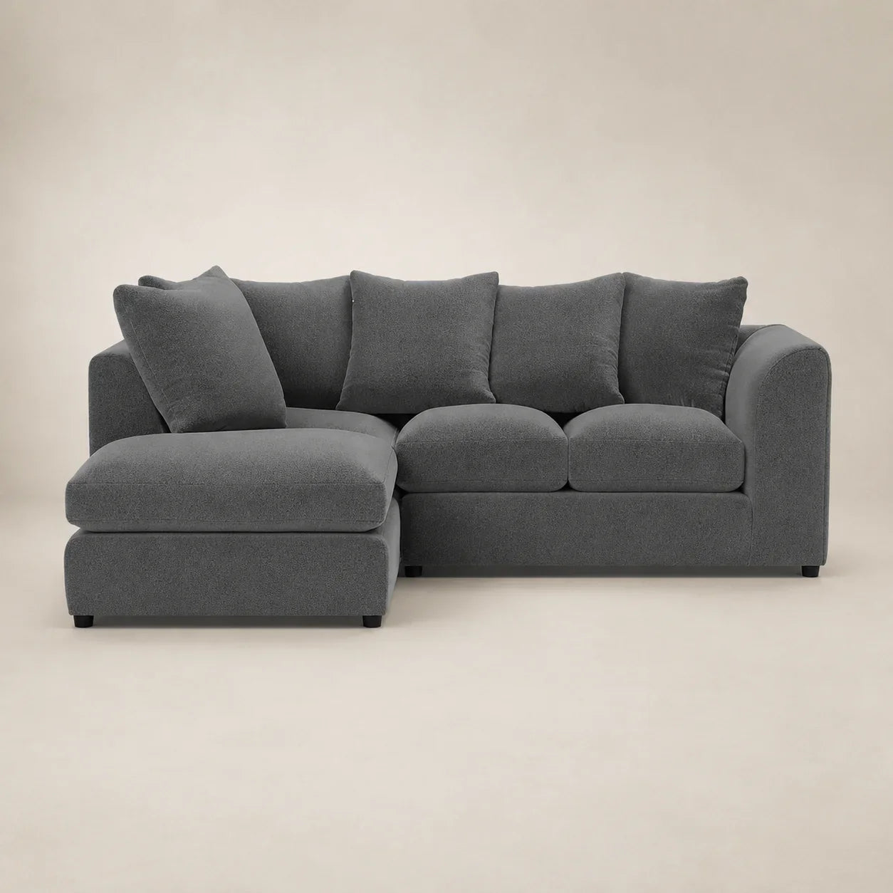 Modern grey sectional sofa with chaise lounge and plush cushions for luxury living room comfort