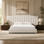Luxury upholstered bed with tufted headboard, white linens, and dark wood nightstands in a modern bedroom