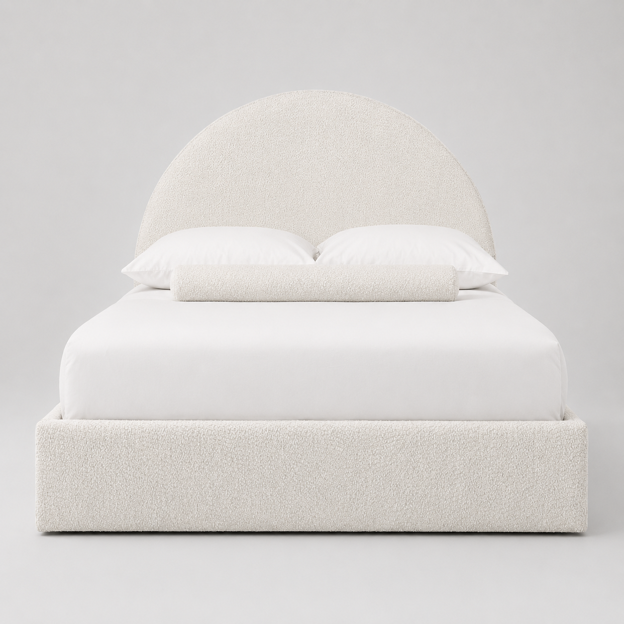 Luxury upholstered bed with curved headboard, white bedding, and textured fabric for modern bedroom
