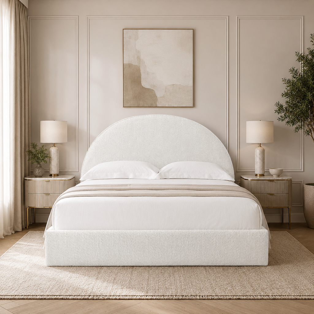 Luxury upholstered bed with curved headboard in neutral bedroom, ideal for modern UK homes